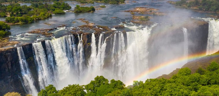 Which majestic cascade, famously known as the "Smoke that Thunders," served as the visual muse for a landmark Disney film?