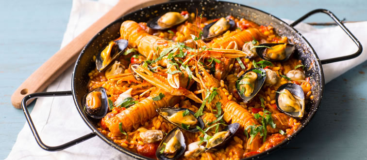 Which country gave us the ultimate stage-stealer dish, "Paella"?